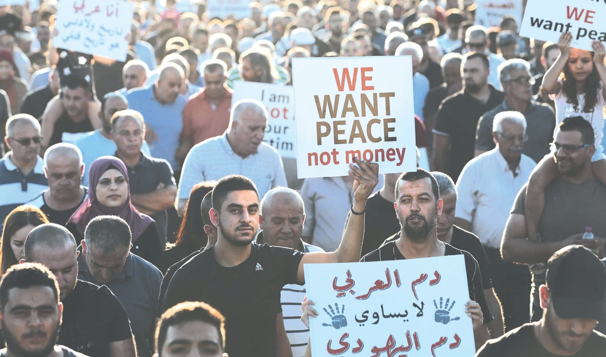 Israeli Arabs, who suffer from widespread discrimination, protest against violence, organized crime and recent killings among their communities, in the Arab town of Majd Al-Krum. (AFP)