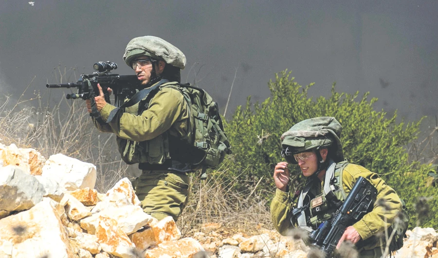 Israeli forces take aim during clashes with Palestinian demonstrators following a weekly protest in the Israeli-occupied West Bank on Friday. (AFP)