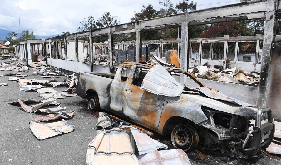 A car burned in September's riot is pictured at damaged office building of Jayawijaya's regent in Wamena, Papua, Indonesia, October 9, 2019 in this photo taken by Antara Foto. (REUTERS)