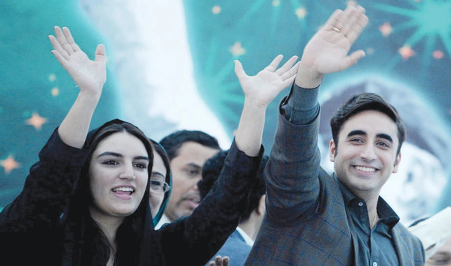 Bilawal Bhutto Zardari and his sister Bakhtawar greet supporters at a rally. (AFP)