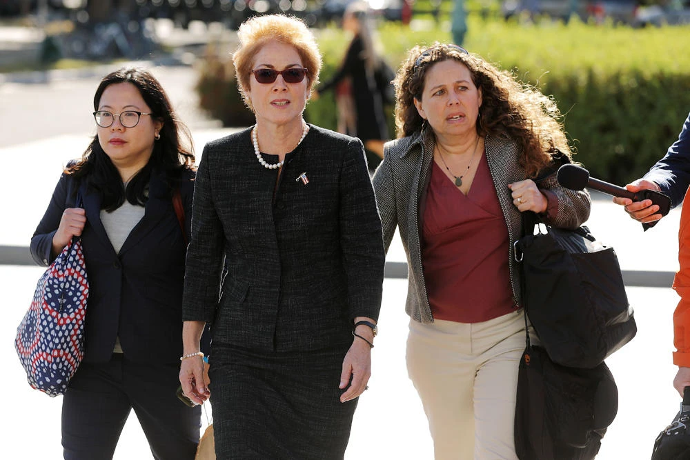 Former US Ambassador to Ukraine Marie Yovanovitch (C) is surrounded by lawyers, aides and journalists as she arrives at the US Capitol on October 11, 2019 in Washington, DC. (Chip Somodevilla/Getty Images/AFP)