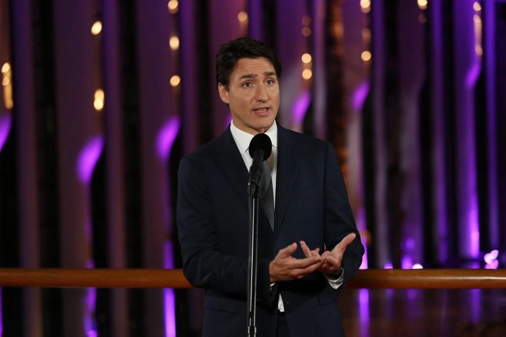 Canadian PM Justin Trudeau was escorted through the crowd by a large number of plainclothes Royal Canadian Mounted Police officers as well as Mounties dressed in green tactical gear. (File/AFP)