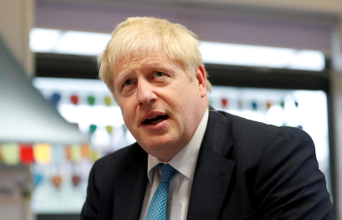 Britain's Prime Minister Boris Johnson participates in an art class during his visit to St Mary's and All Saints Primary School in Beaconsfield, Britain October 11, 2019. (Reuters)