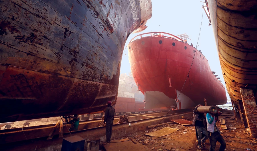 Dock workers at a shipyard in Dhaka, Bangladesh. Shipbuilding in Bangladesh has become a major industry in recent years. (Shutterstock)