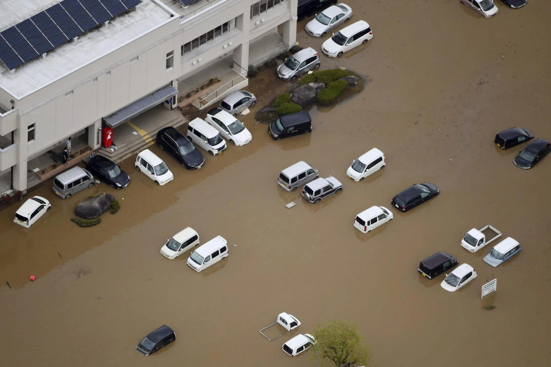 Vehicles are seen under water following the typhoon-hit town of Marumori, Miyagi prefecture, Japan , Monday, Oct. 14, 2019.(AP)