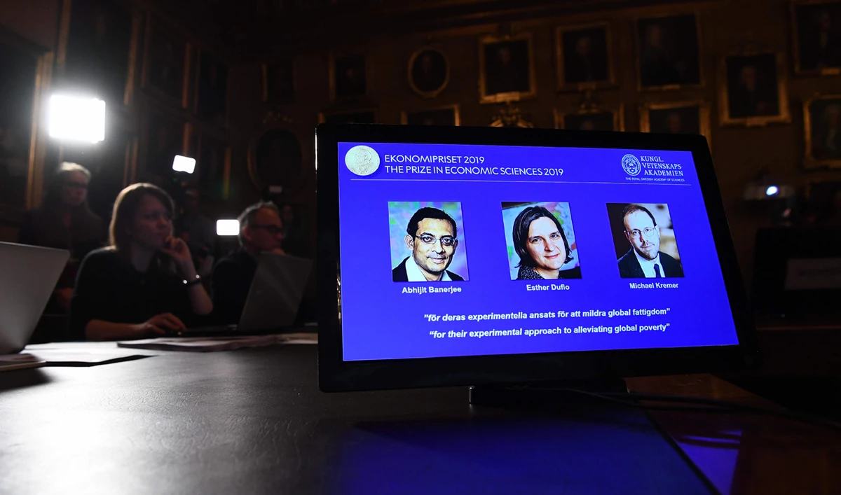 Indian-born Abhijit Banerjee of the US, French-American Esther Duflo and Michael Kremer of the US during the announcement of the winners of the 2019 Nobel Prize in Economic Sciences. (AFP)
