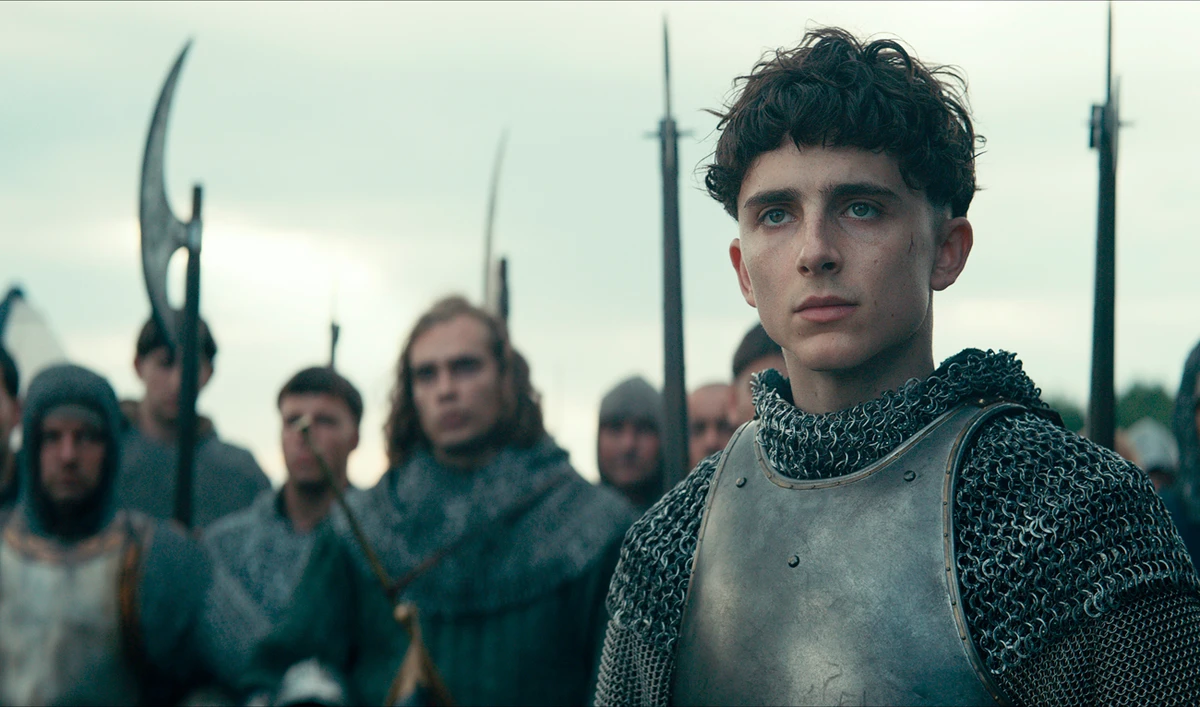 This image released by Netflix shows Timothée Chalamet, center, in a scene from "The King."