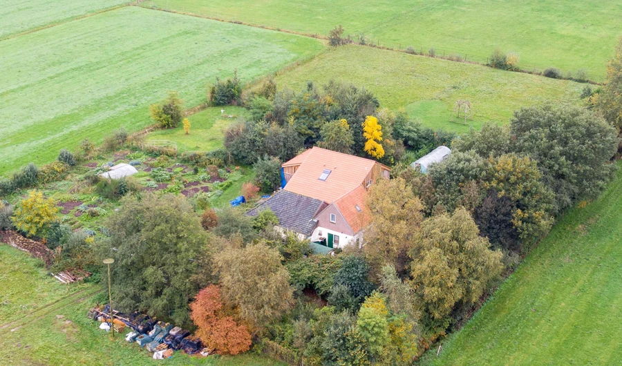 An aerial picture taken on October 15, 2019 shows a view of the farm where a father and six children had been living in the cellar, In Ruinerwold, northern Netherlands. (AFP)