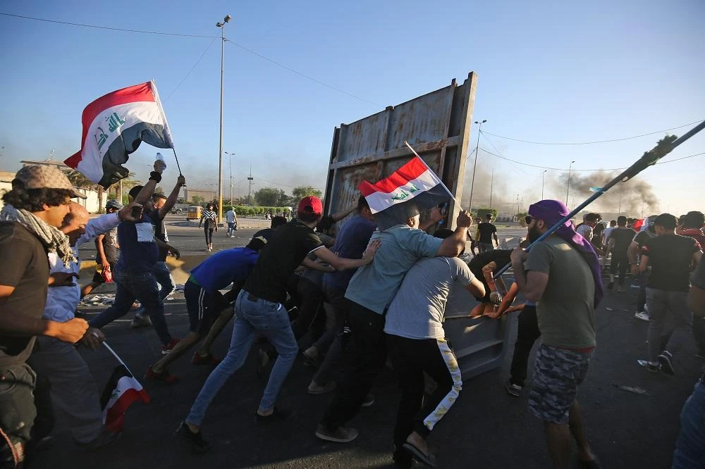 Iraqi security forces said "unidentified snipers" killed four people across the capital Baghdad today, the fourth day of violent anti-government protests. (File/AFP)