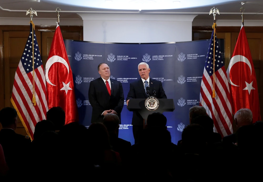 Mike Pence announces a ceasefire deal with Turkey, as Secretary of State Mike Pompeo looks on, at the US Embassy in Ankara on Thursday. (Reuters)