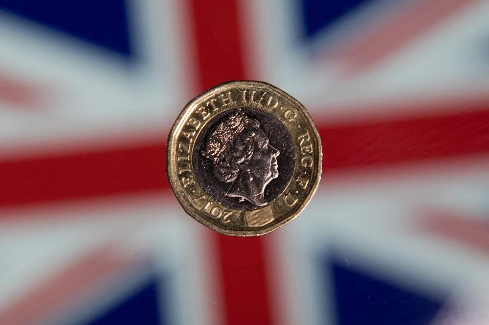 Forex traders sold sterling, pushing it back down below $1.29, and it extended losses in Asia. (File/AFP)
