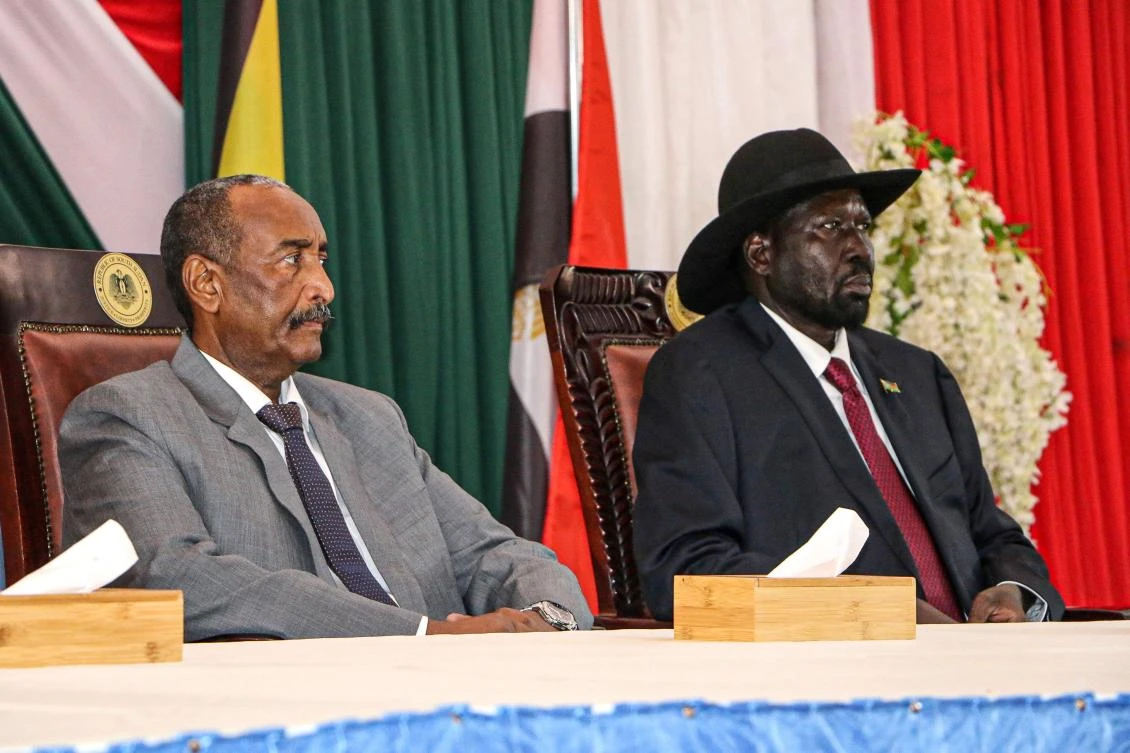 President of Sudanese Transitional Council General Abdel Fattah al-Burhan (L) and President of South Sudan Salva Kiir attend a meeting to endorse the peace talks between Sudan's government and rebel leaders in Juba, South Sudan, on October 14, 2019. (AFP)