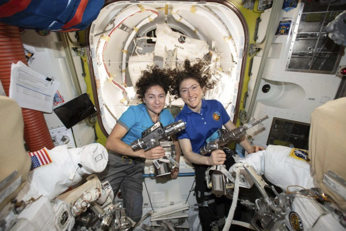 US astronauts Jessica Meir, left, and Christina Koch pose for a photo in the International Space Station. (NASA via AP)