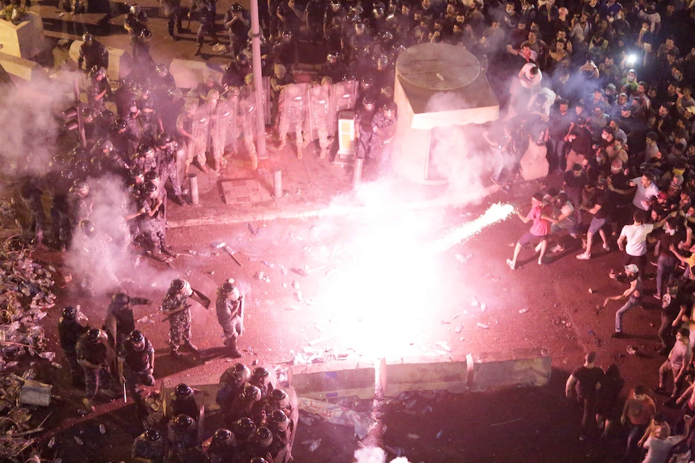 Protesters clash with police on the streets of Lebanon. (AP)