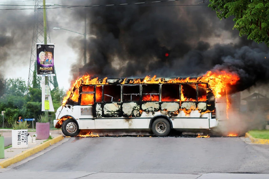 A burning bus, set alight by cartel gunmen to block a road, is pictured during clashes with federal forces following the detention of Ovidio Guzman, son of drug kingpin Joaquin "El Chapo" Guzman, in Culiacan, Sinaloa state, Mexico on October 17, 2019. (REUTERS/Jesus Bustamante)