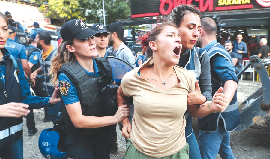 A protester is detained by police during a rally against the Turkish government’s removal from office of three pro-Kurdish mayors, in Ankara. (Reuters)