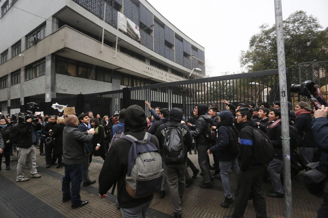 Violent clashes escalated as night fell, and the ENEL power company building and a Banco Chile branch, both in the city center, were set on fire. (File/AFP)