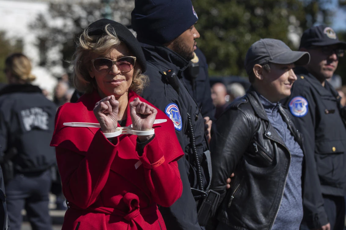 Actress Jane Fonda gestures after being arrested during a climate change rally on Capitol Hill in Washington on Friday, Oct. 18, 2019. (AP)