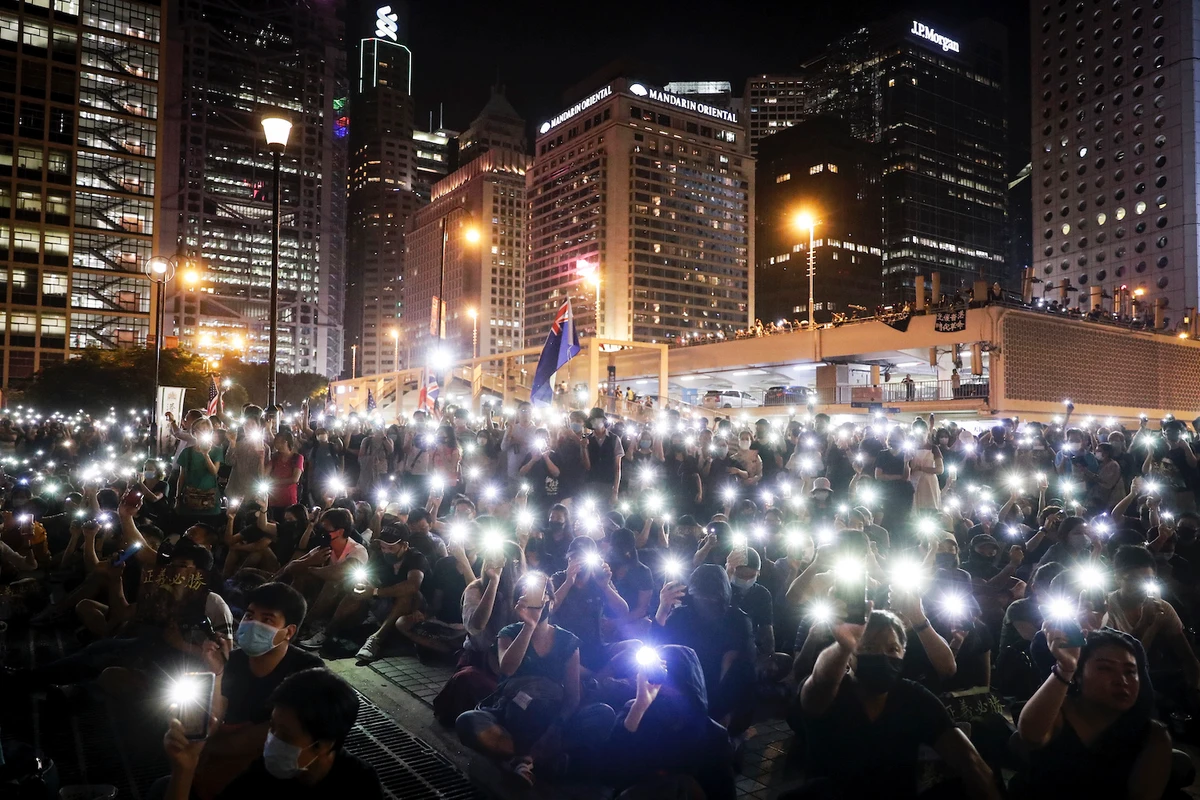 Protesters flash their smartphones' lights to support the prayer rally at Edinburgh Place in Hong Kong, Saturday, Oct. 19, 2019. (AP)