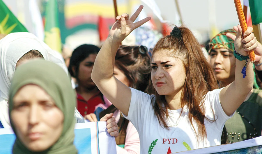 A Syrian protester gestures during a demonstration in the northern Syrian town of Hasakeh against the Turkish offensive on Kurdish-held towns. (AFP)