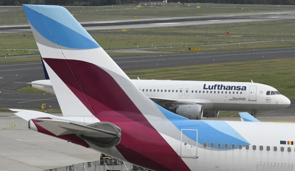 An all-day strike at Lufthansa brands including Eurowings, bottom plane, would now be extended until midnight in an escalating row over workers’ pay and pensions. (AFP)