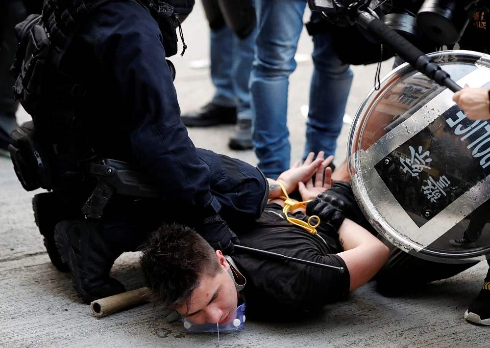 Hong Kong police detain an anti-government demonstrator during a protest on Sunday, October 20, 2019. (Reuters)