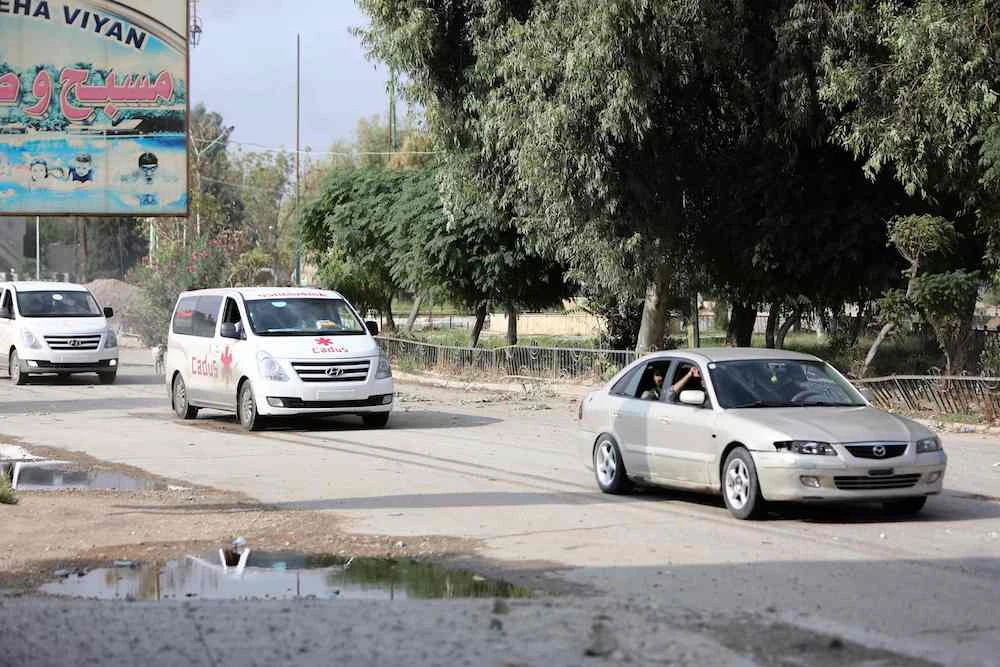 Kurdish fighters withdraw from besieged Syria town