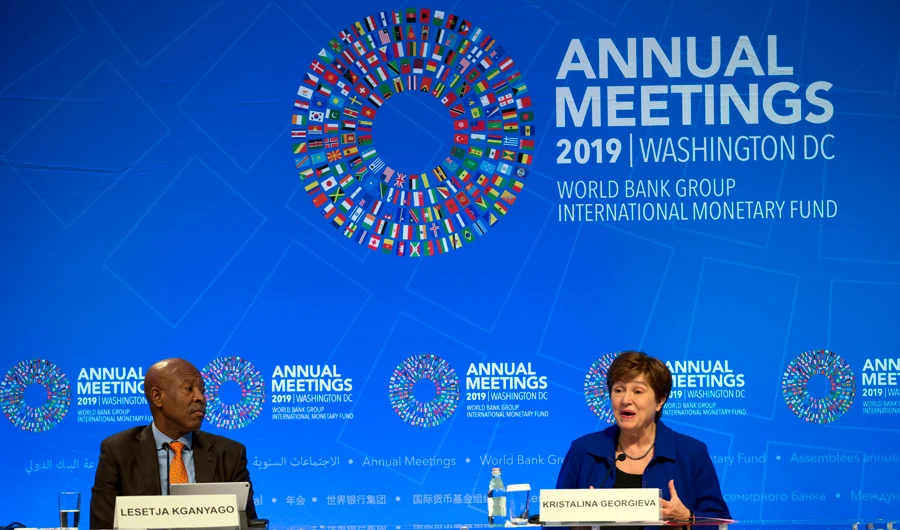 International Monetary Fund Managing Director Kristalina Georgieva (right), accompanied by South Africa's Reserve Bank Governor Lesetja Kganyago, speaks during a news conference after in Washington on Oct. 19, 2019. (AP Photo/Jose Luis Magana)