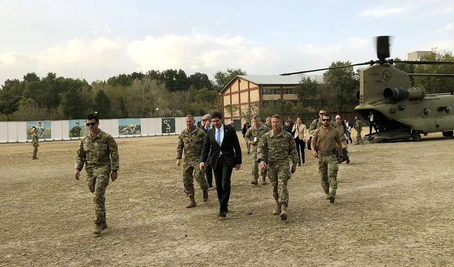U.S. Defense Secretary Mark Esper, center, walks Gen. Scott Miller, right, chief of the U.S.-led coalition in Afghanistan, at the U.S. military headquarters in Kabul, Afghanistan, Sunday, Oct. 20, 2019. (AP)