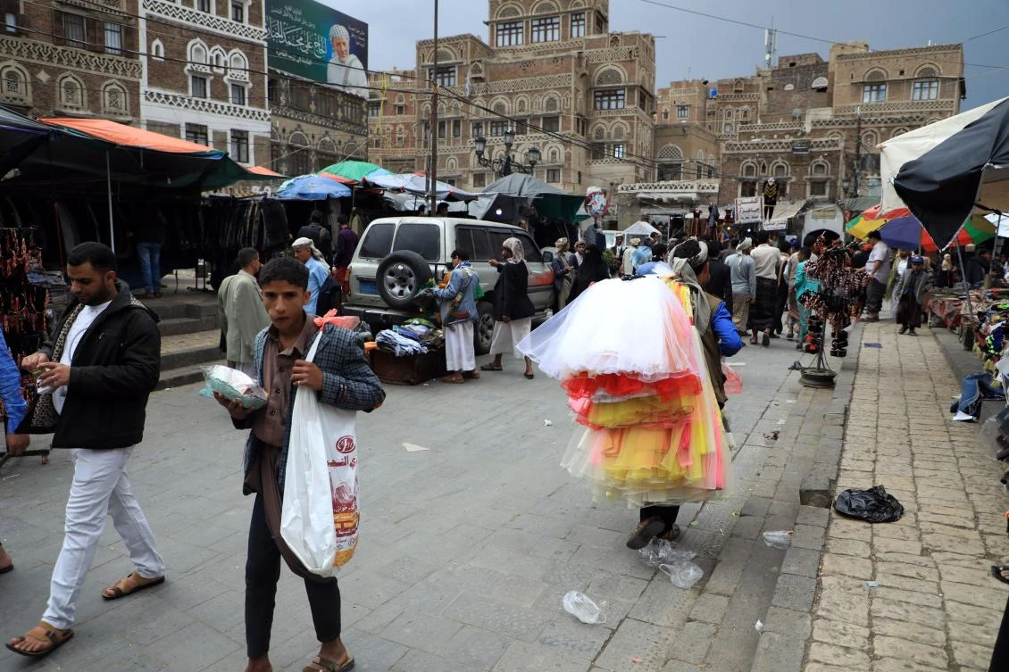 Shoppers at a market in the Yemeni capital Sanaa’s old quarter. The Baha’i community believes its position in the country is in a perilous position. (AFP)