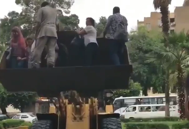 Heavy rain across Cairo cause chaos as residents use bulldozer to escape floods