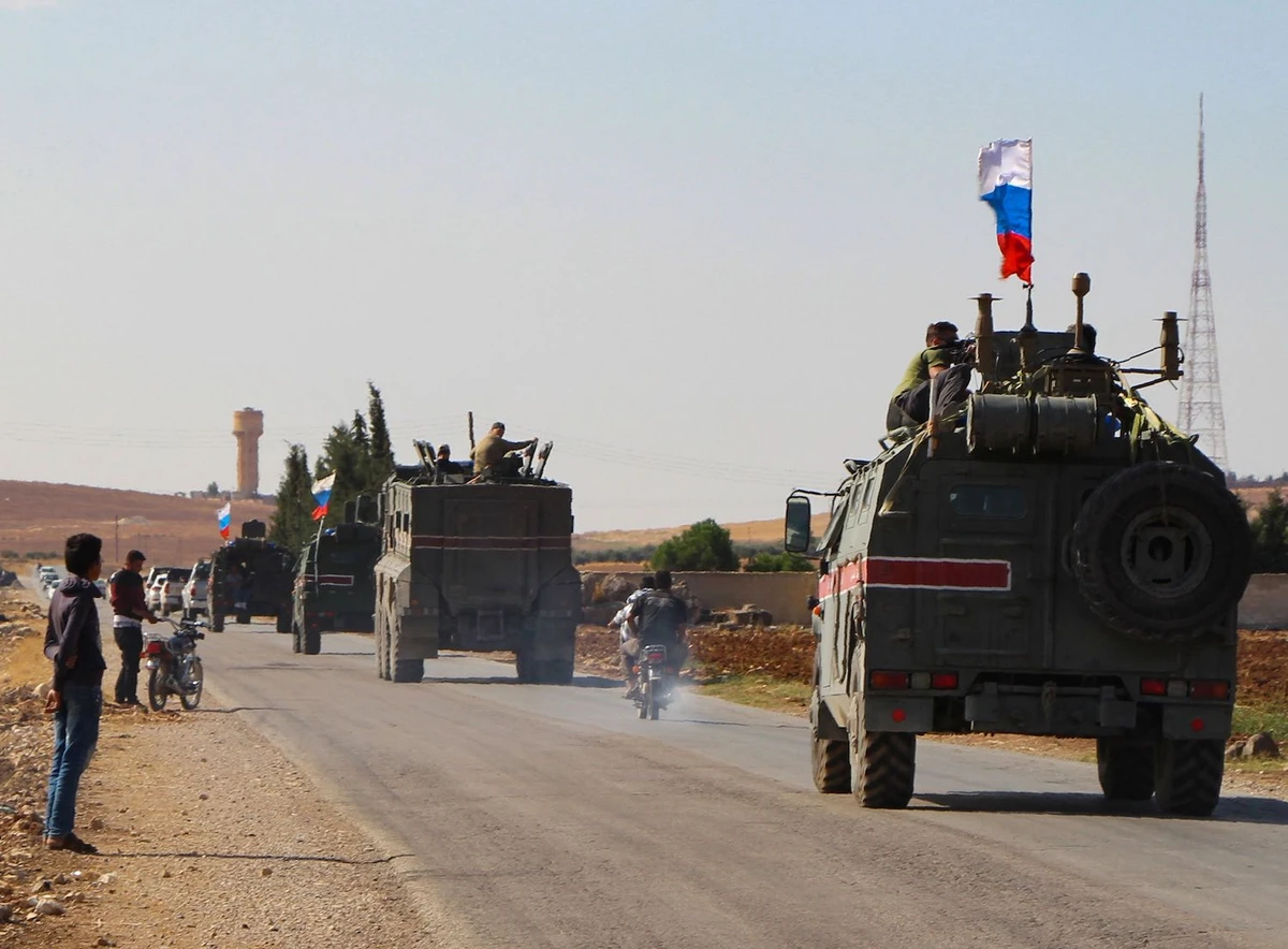 A convoy of Russian military vehicles drives toward the northeastern Syrian city of Kobane on October 23, 2019. (AFP)