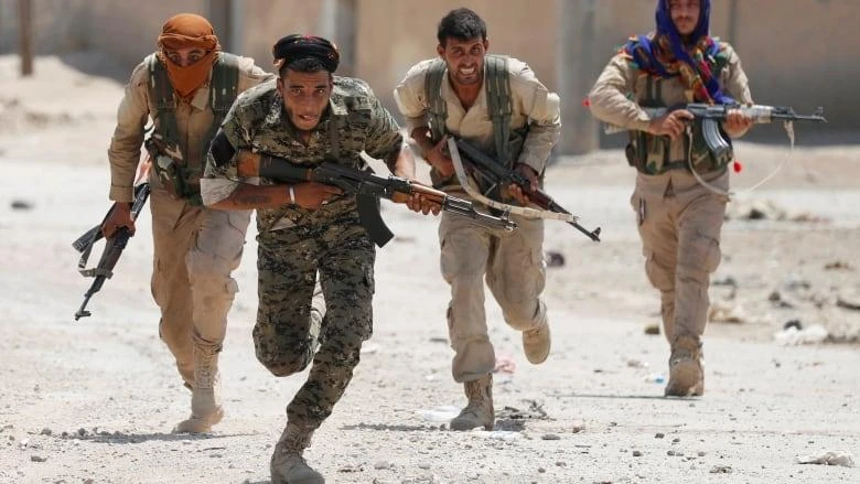 Fighters of the Kurdish People’s Protection Units (YPG) — the main component of the SDF — remain in many positions along the 440 kilometer border. (Reuters)