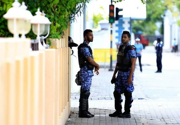 Maldives riot police officers stand in front of the parliament during a protest against the Maldives police, in Male October 19, 2013. (Reuters)