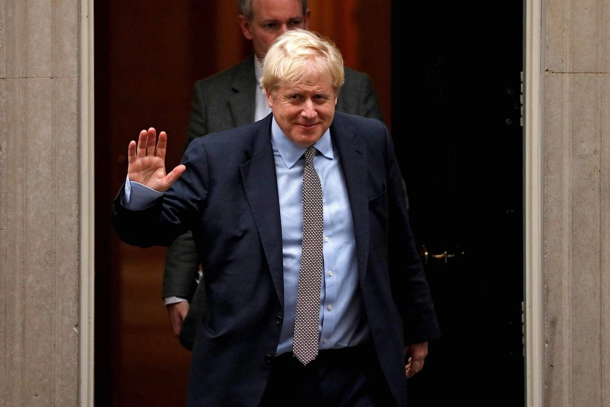 Britain's Prime Minister Boris Johnson waves as he leaves 10 Downing Street, central London on October 24, 2019, after taking a political Cabinet meeting. (AFP)
