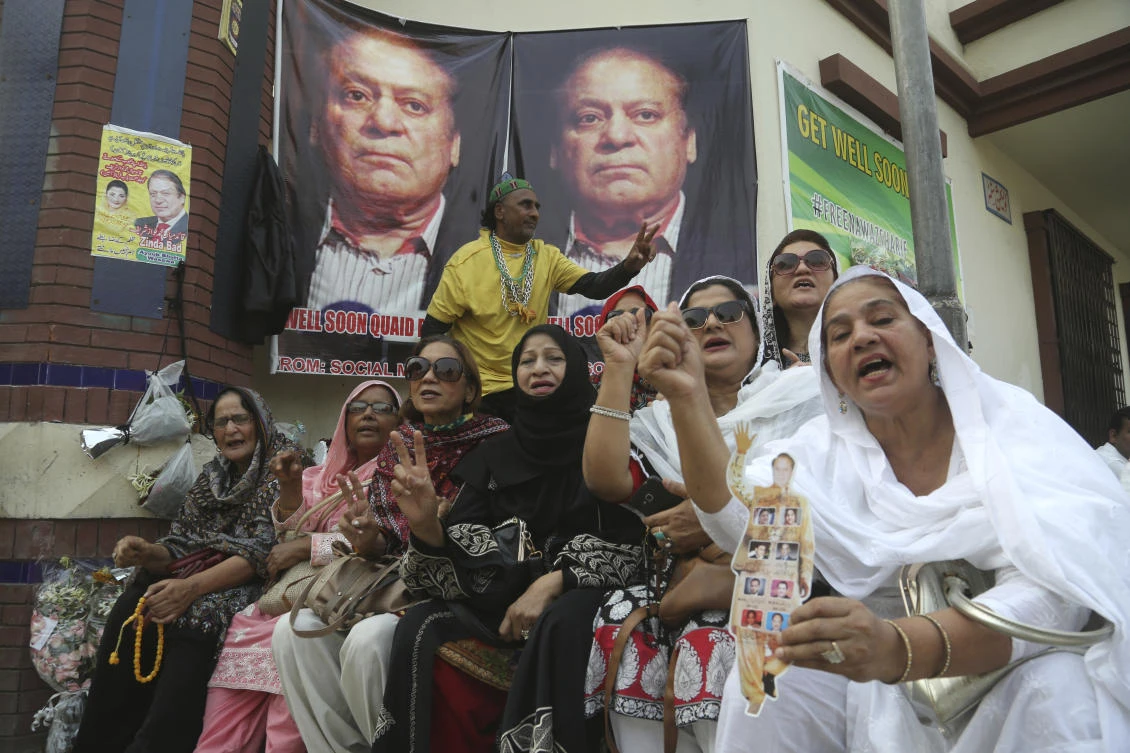 Supporters of Pakistani former Prime Minister Nawaz Sharif shout anti government slogans outside a hospital where Sharif admitted in Lahore, Pakistan, Thursday, Oct. 24, 2019. (AP)