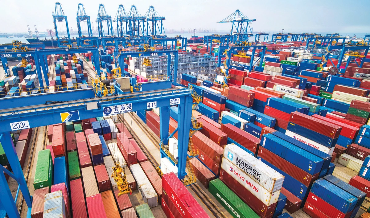 Containers are piled up at a port in China. Ongoing trade tensions could hit earnings in the second half of 2019, according to analysts. (AP)