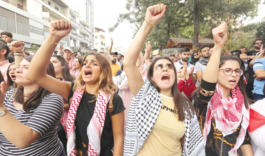 Demonstrators shout slogans during an anti-government protest in the southern city of Nabatieh, Lebanon, on Thursday. (Reuters)