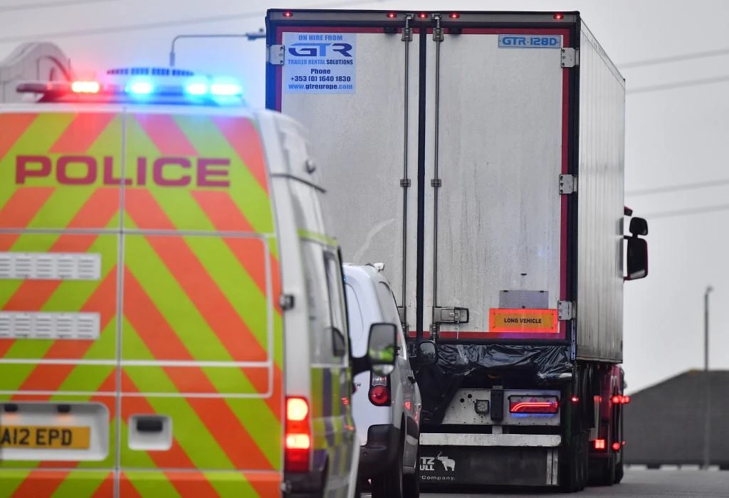 Police officers drive away a truck in which 39 dead bodies were discovered at Waterglade Industrial Park in Grays, east of London, on October 23, 2019. (AFP)