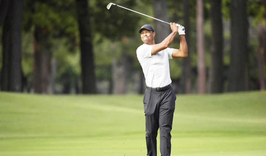 Tiger Woods shoots on the 9th hole during the second round of the Zozo Championship, a PGA Tour event, at Narashino Country Club in Inzai, Chiba Prefecture, east of Tokyo, Japan October 26, 2019, in this photo released by Kyodo. (REUTERS)