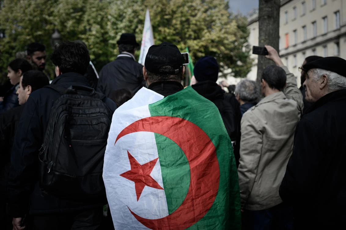 A man wearing the Algerian national flag takes part in a protest against political repression in Algeria, near the National Assembly in Paris on October 24, 2019. (File/AFP)