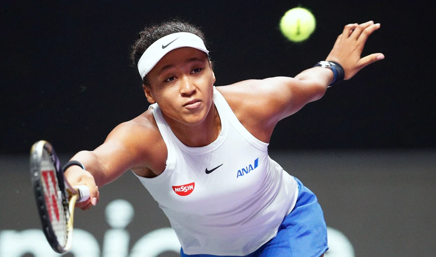 Naomi Osaka of Japan hits a return against Petra Kvitova of the Czech Republic during their WTA Finals Tennis Tournament in Shenzhen, China's Guangdong province, Sunday, Oct. 27, 2019. (AP)
