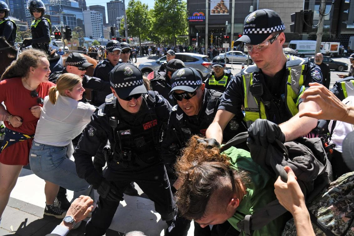 Police arrest a climate change protester attempting to disrupt the International Mining and Resources Conference (IMARC) being held in Melbourne on October 29, 2019. (AFP)
