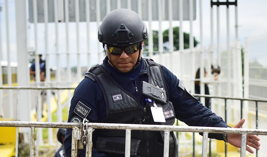 Mexican Federal Police officer stand guards in Ciudad Hidalgo, Chiapas state, Mexico. (AFP)