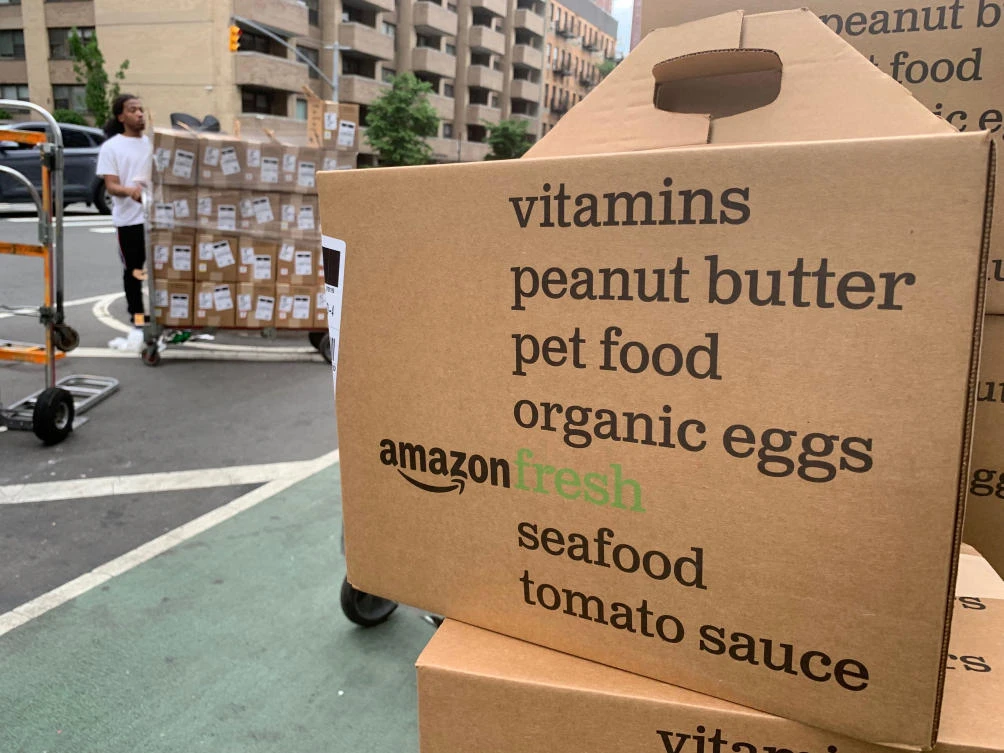 In this June 16, 2019, file boxes of Amazon Fresh deliveries are unloaded in New York. (AP)