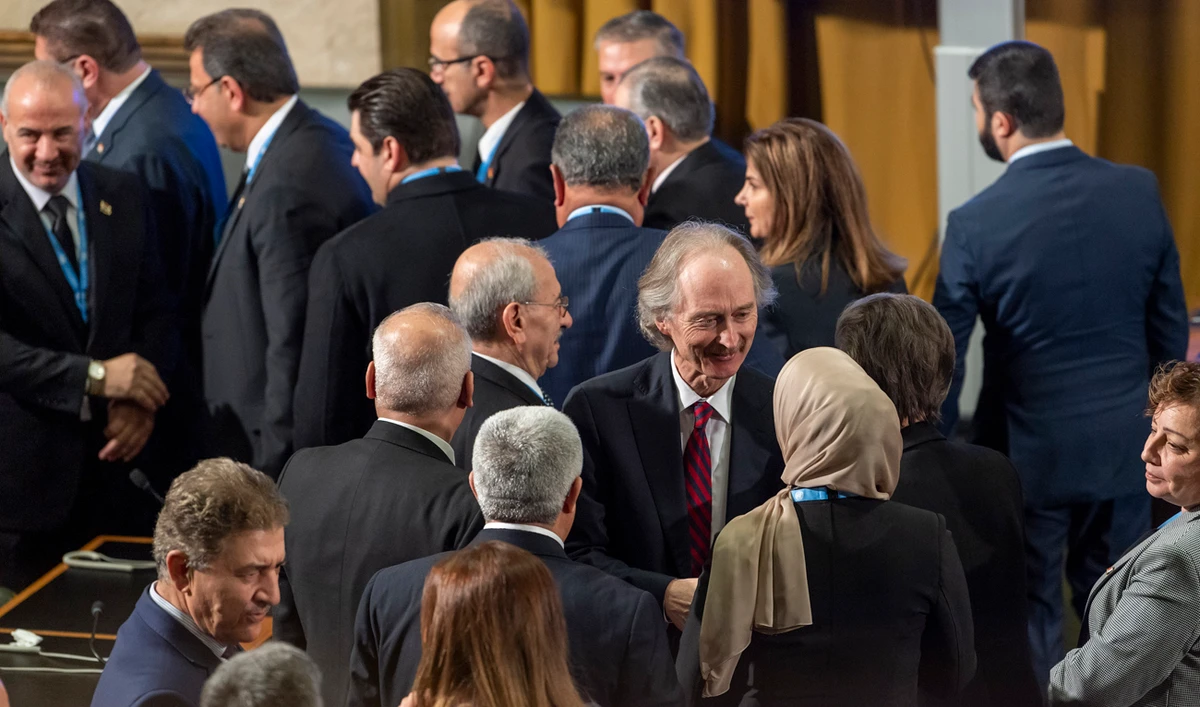 Geir O. Pedersen, center, Special Envoy for Syria shakes hands with members of the Government, after the first meeting of the Syrian Constitutional Committee, at the European headquarters of the United Nations in Geneva Switzerland, Wednesday, October 30, 2019. (AP)