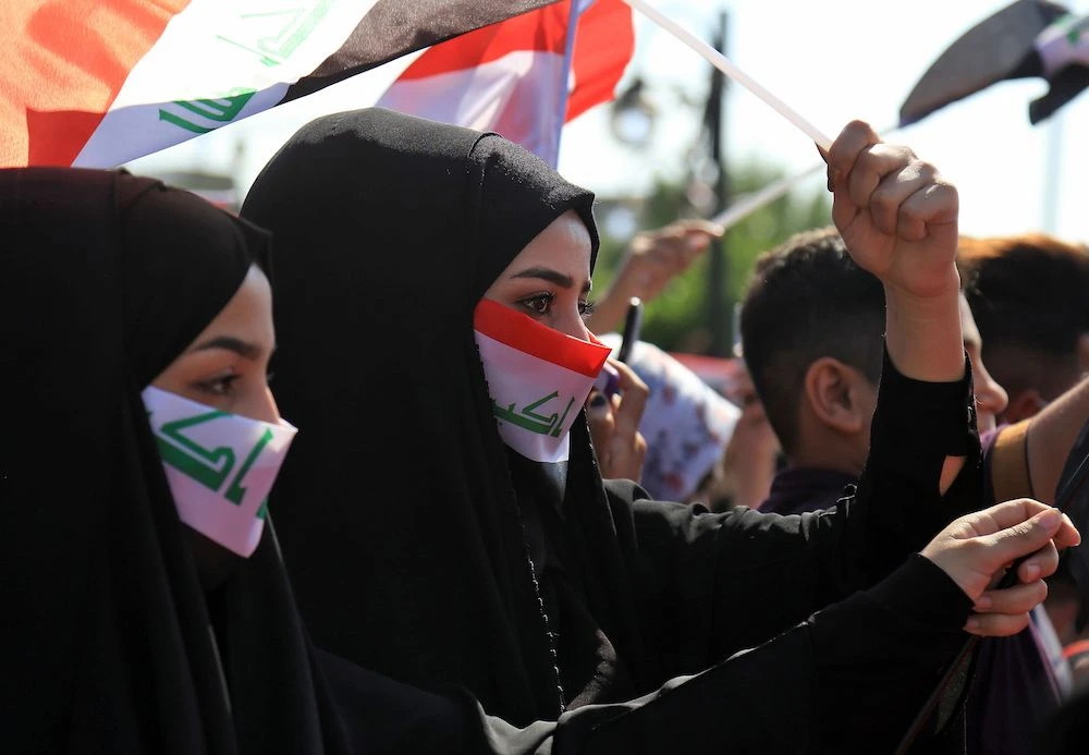 Iraqis take part in ongoing anti-government protests in Karabala Thursday. (AFP).