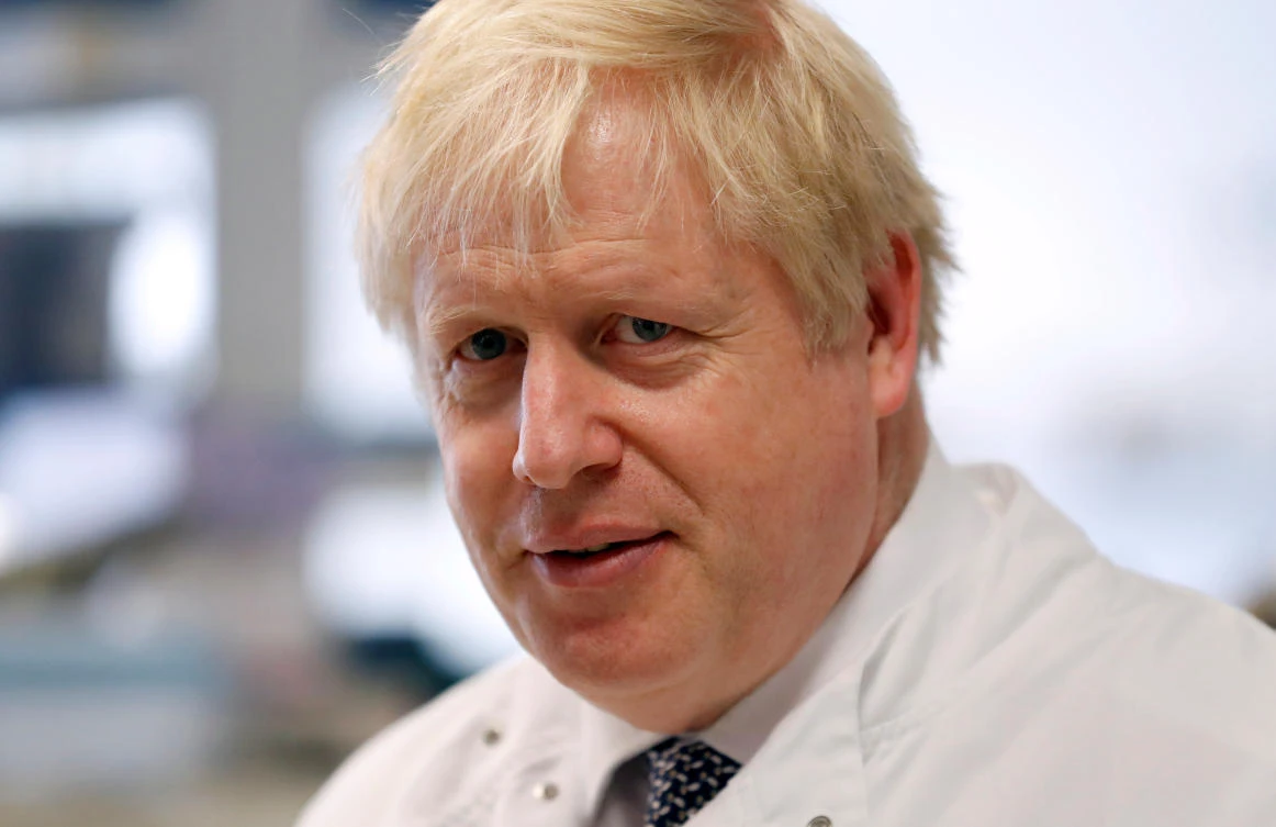 British Prime Minister Boris Johnson speaks to Dr Sarah Bowdin at the National Institute for Health Research at the Cambridge Clinical Research Facility, in Addenbrooke's Hospital in Cambridge, Britain. (Reuters)