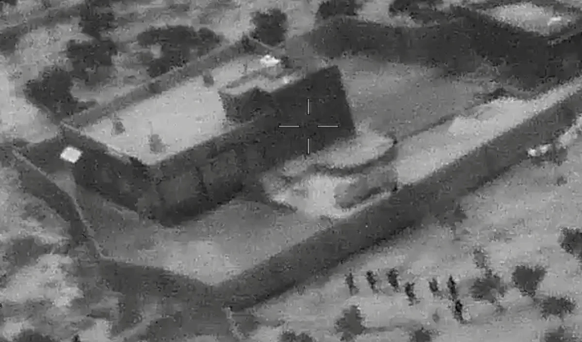 U.S. special forces move towards the compound of Islamic State leader Abu Bakr al-Baghdadi during a raid in the Idlib region of Syria. (Reuters)
