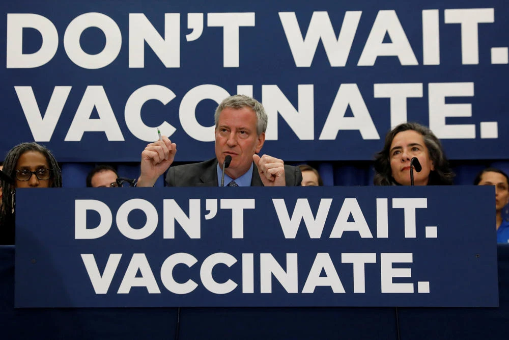 In this April 2019 photo, New York City Mayor Bill de Blasio speaks during a news conference declaring a public health emergency in parts of Brooklyn in response to a measles outbreak. Health experts are saying measles, which is once more on the rise globally, is more harmful than previously thought. (REUTERS/Shannon Stapleton/File Photo)